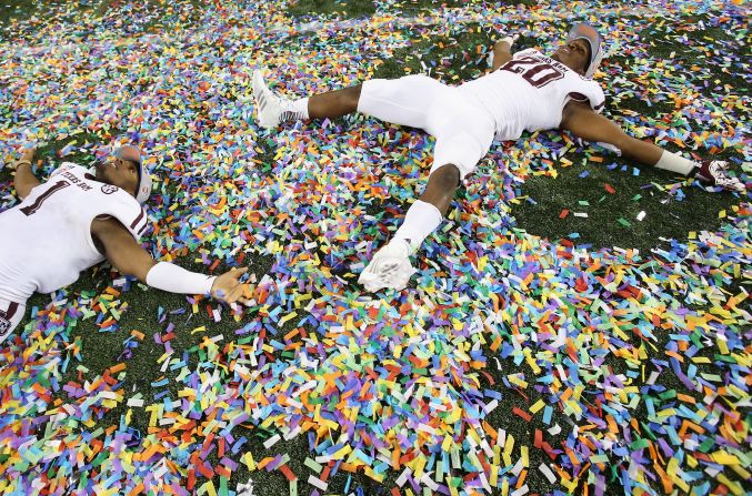Ben Malena, left, and Trey Williams of the Texas A&M Aggies celebrate a 41-13 win against the Oklahoma Sooners during the Cotton Bowl on Friday, January 4, in Arlington, Texas. 