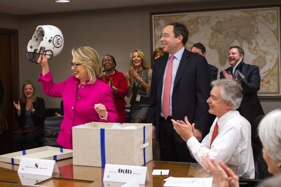 State Department leaders gifted Clinton "a football helmet with a State Department seal, lots of good padding," spokeswoman Victoria Nuland said.  