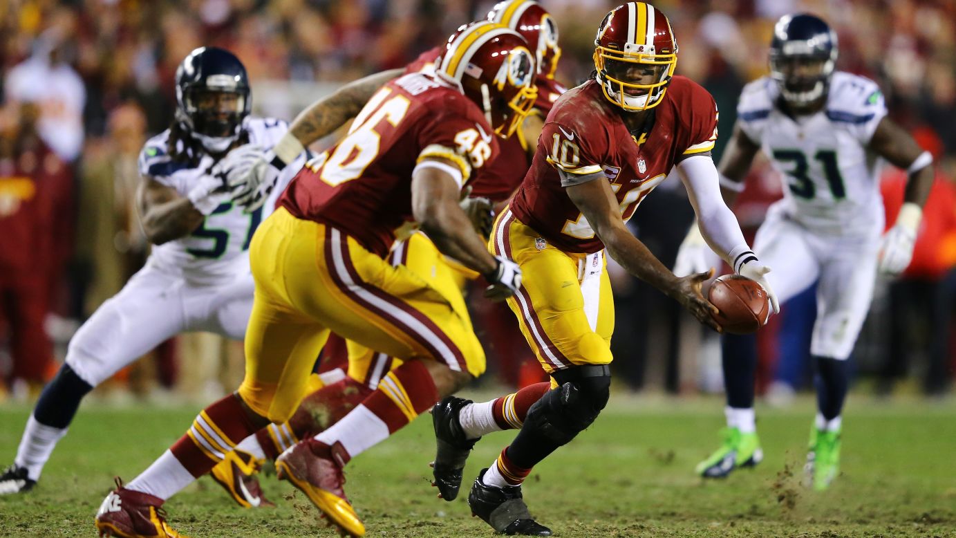 Robert Griffin III laterals to Alfred Morris of the Washington Redskins in the third quarter on Sunday.