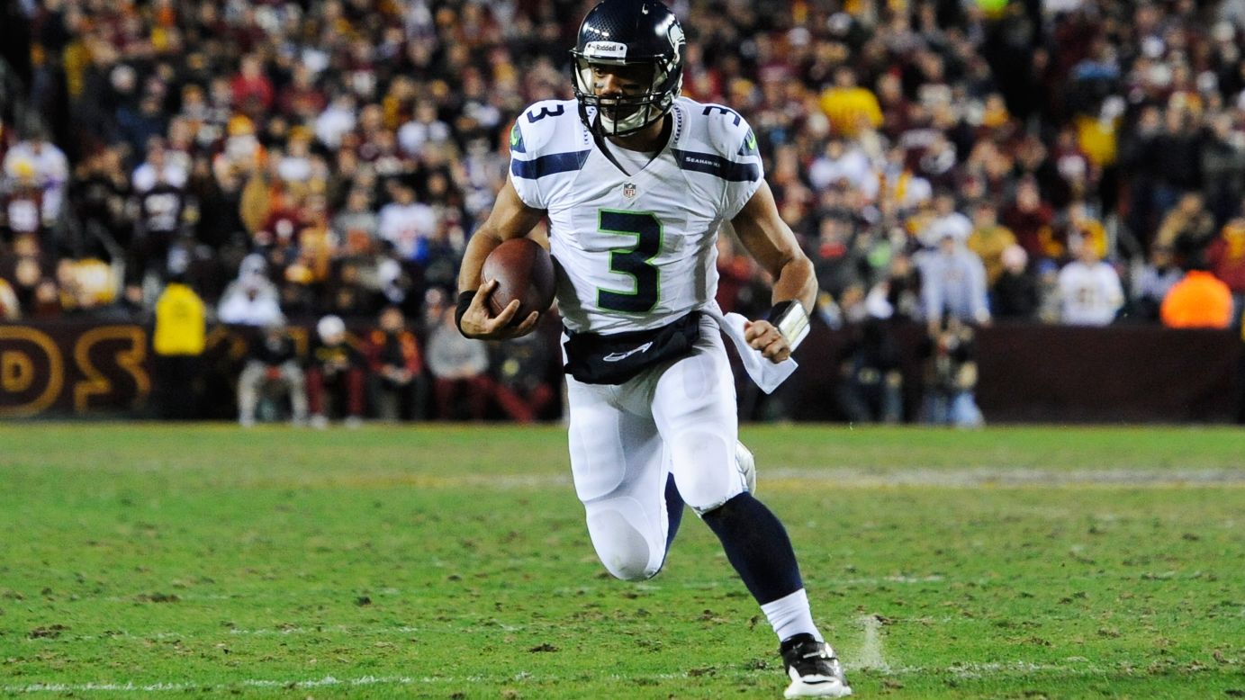 Russell Wilson of the Seattle Seahawks runs the ball for a first down on Sunday.