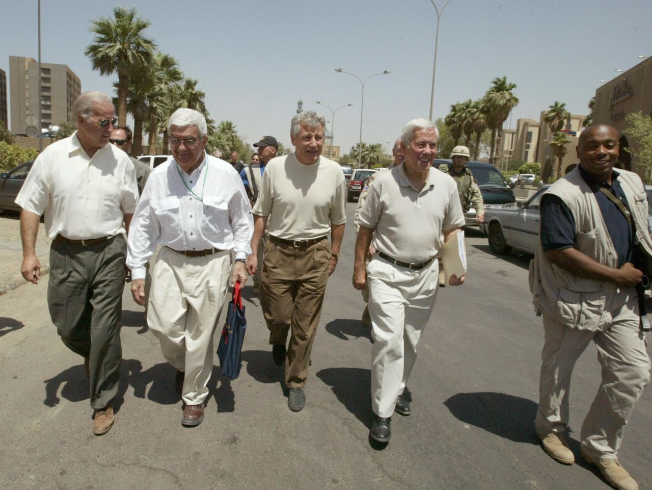 Joe Biden, left, then a U.S. senator from Delaware, walks with Sen. Richard Lugar, second from right, and Hagel, center, at a hotel in Baghdad in June 2003. The congressional delegation was on a tour of the Iraqi capital the year the Iraq War began. 