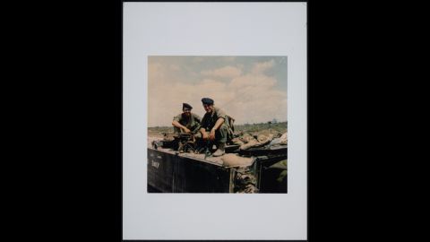 Hagel, right, perched on top of a M113 armored personnel carrier in 1968.