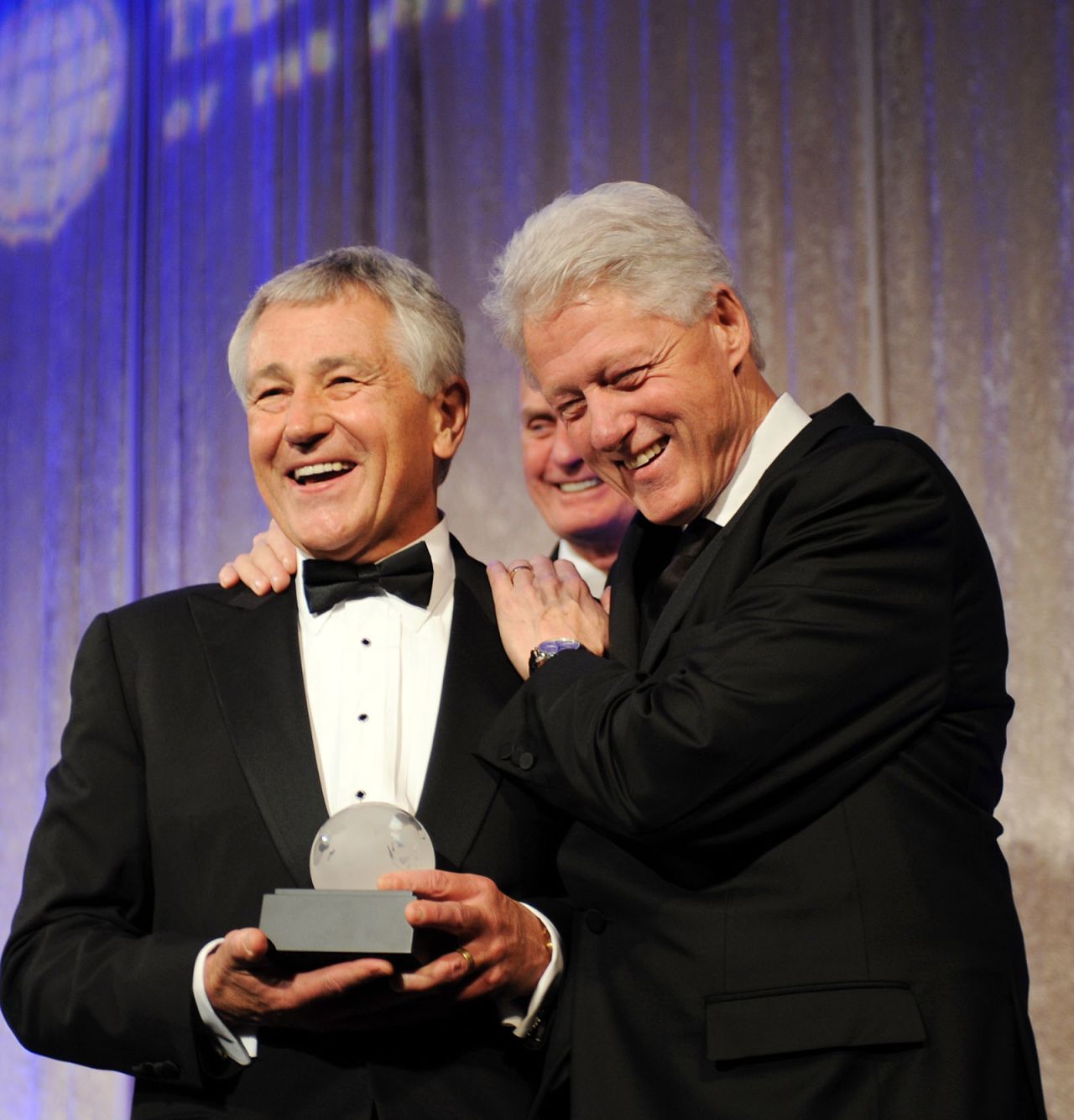 Hagel presents former President Bill Clinton with the Atlantic Council's Distinguished International Leadership Award in Washington in April 2010. 