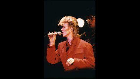 Bowie performs sporting a blond mullet in 1987.