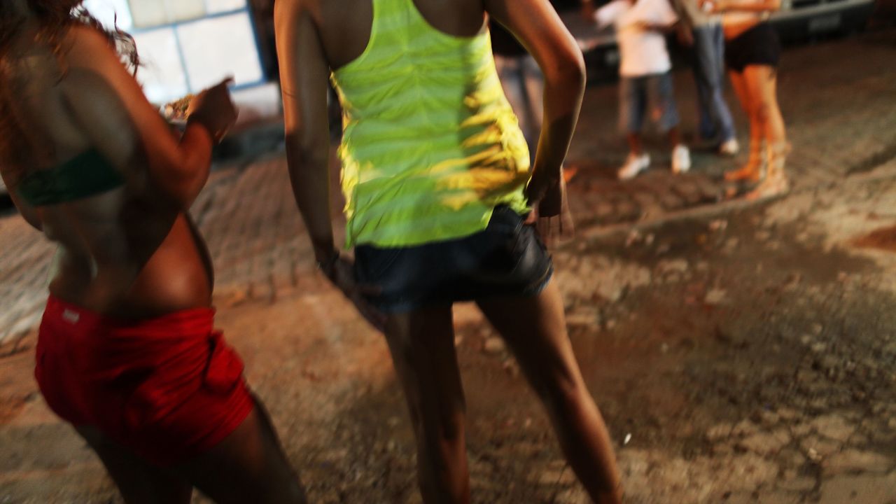 (File photo) Female prostitutes walk the streets following a fashion show with clothes designed by sex workers on December 11, 2009 in Rio de Janeiro, Brazil.