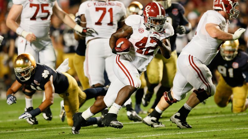Alabama running back Eddie Lacy carries the ball against Notre Dame on Monday.