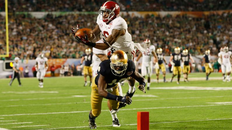 Ha'Sean Clinton-Dix of Alabama intercepts a pass intended for Notre Dame's DaVaris Daniels in the third quarter.