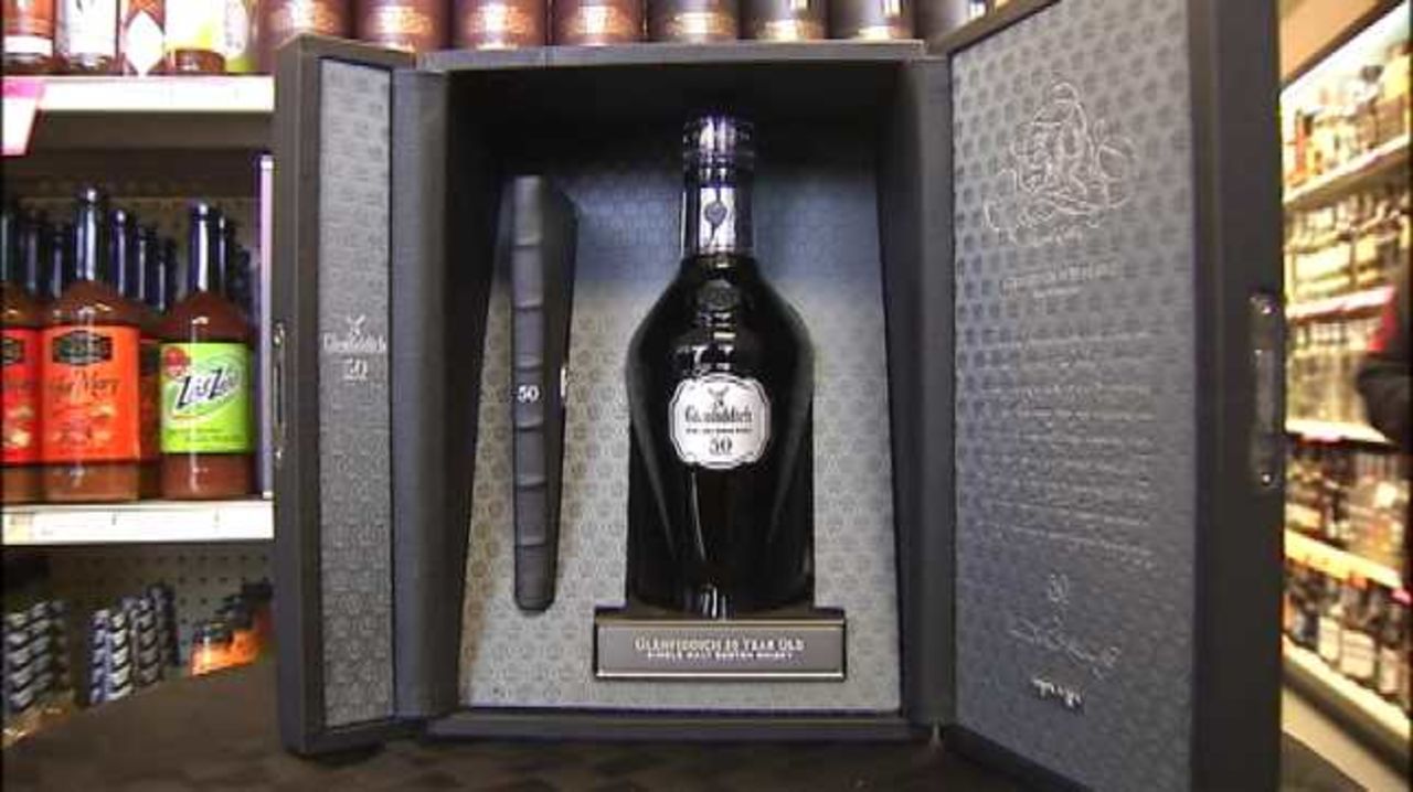 The handcrafted bottle of 50-year-old bottle of Glenfiddich Scotch arrived at the liquor store in a locked leather case.