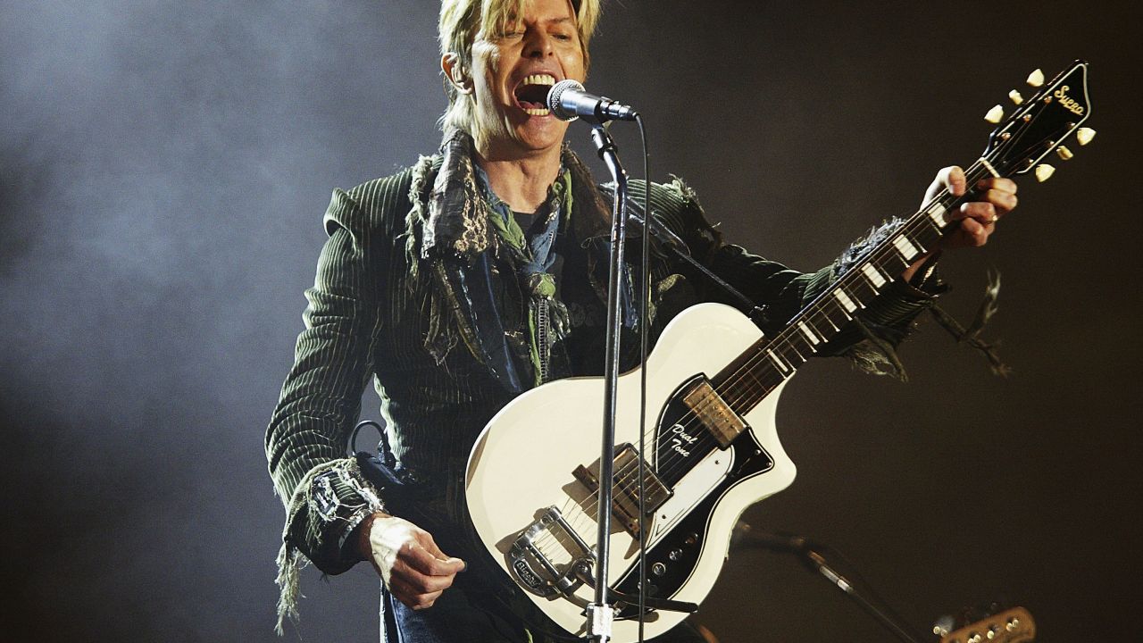 David Bowie performs in June 2004 in Wales.