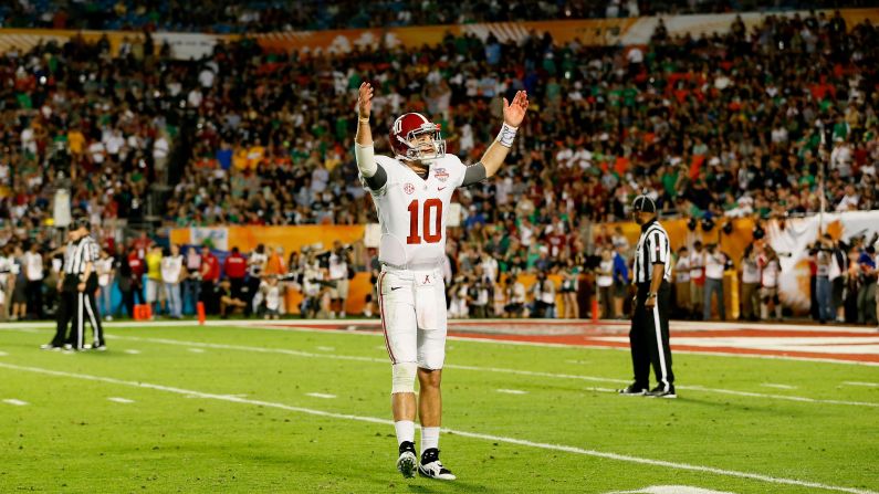 Alabama's AJ McCarron acknowledges the crowd during the game on Monday.