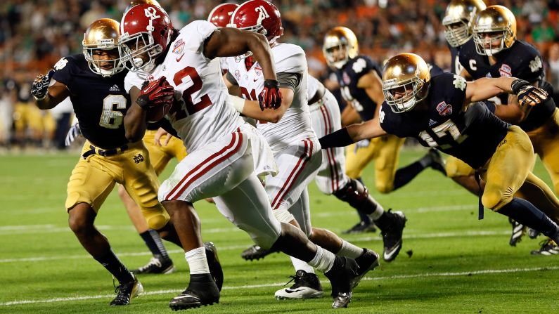Alabama running back Eddie Lacy carries the ball against Notre Dame.