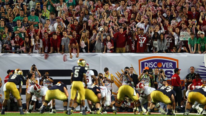 Alabama fans cheer as Notre Dame's offense lines up late in the game on Monday.