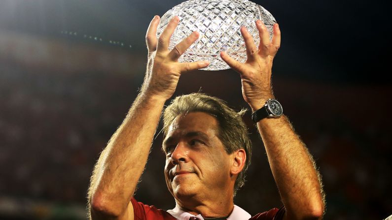 Alabama head coach Nick Saban celebrates with the trophy after defeating Notre Dame. His team won its second consecutive BCS title and third in four seasons.