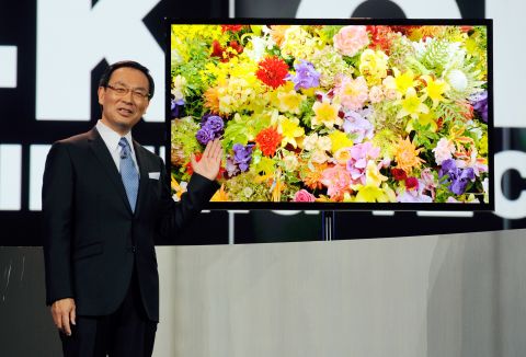 CEO Kazuhiro Tsuga unveils Panasonic's new 4K OLED televison Tuesday at CES. 