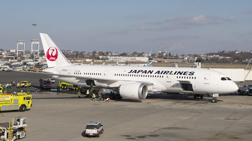 Firefighters investigate the interior of a Japan Airlines 787 Dreamliner after reports of smoke in the aircraft at Boston Logan International Airport in Boston, Massachusetts, on Monday, January 7.