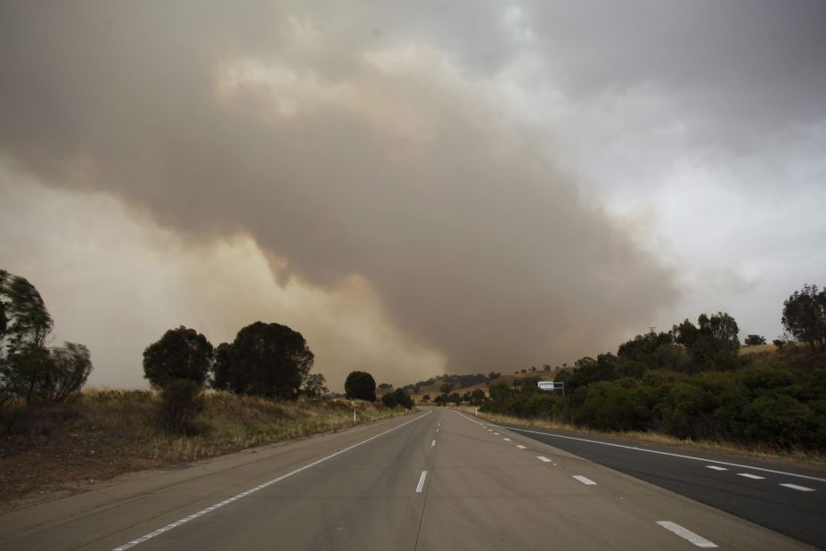 Smoke is seen billowing over the closed Hume Highway near Tarcutta in New South Wales on Tuesday.