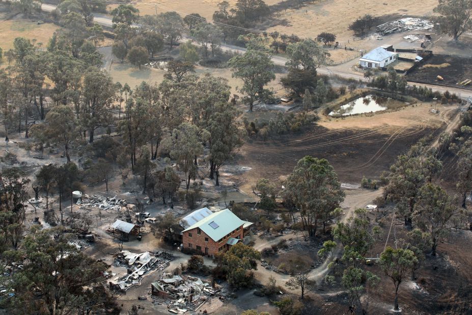 Buildings lie in ruins on Saturday, January 5, from bush fires that hit Dunalley, a town on the Australian island state of Tasmania.
