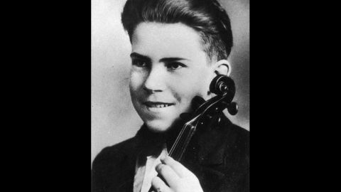 As a teenager, Nixon poses for a portrait with a violin in 1927.