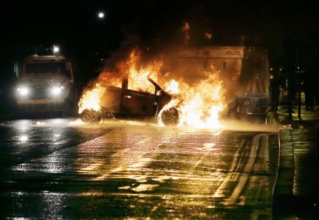 A car burns after the protests on Sunday, January 6.