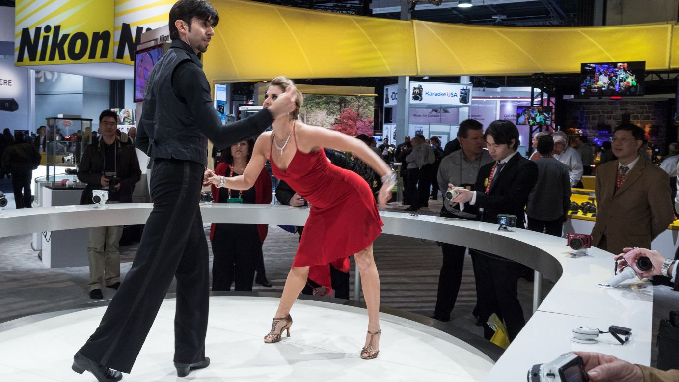 People who wanted to demo Nikon's new cameras Tuesday could snap photos of these dancers at the Nikon booth.