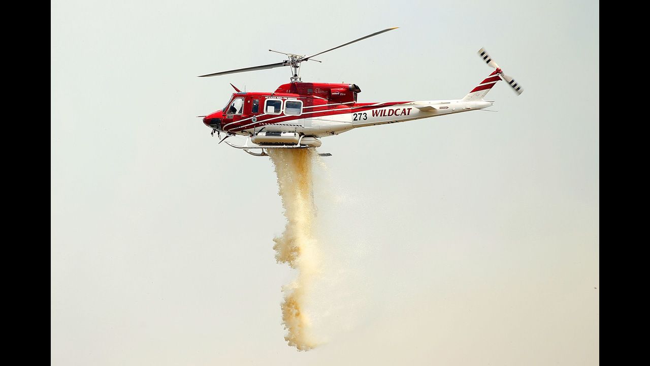 A chopper carries out water-bombing operations on a fire at Sandhills in Bungendore on January 9.