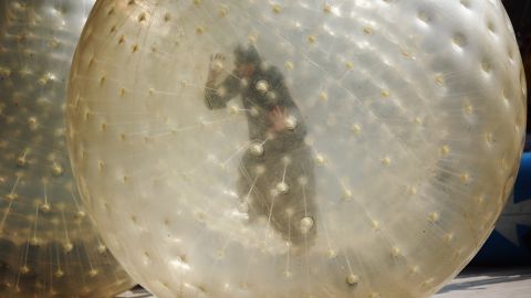 (File photo)  A woman plays in a Zorb ball in a park on April 24, 2011 in England.