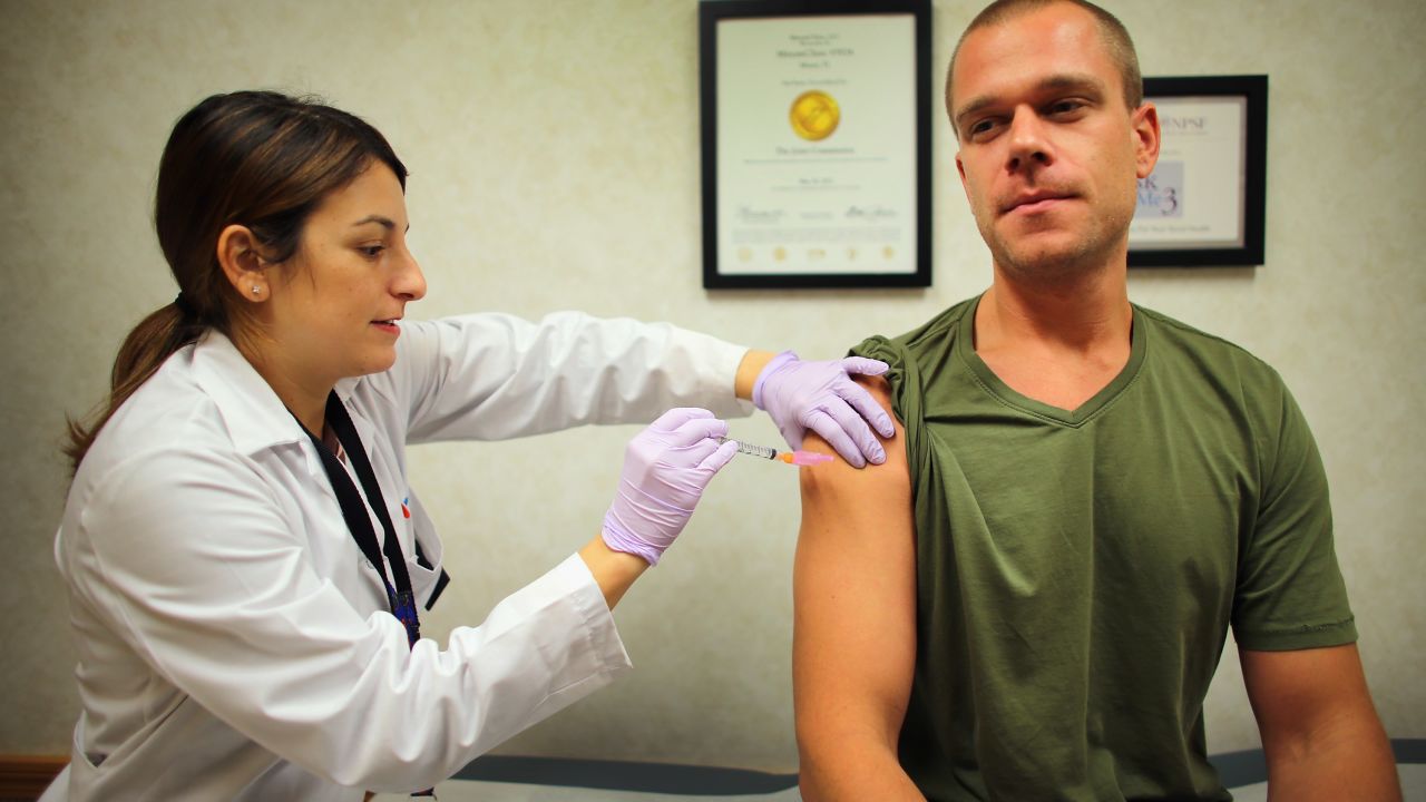 MIAMI, FL - DECEMBER 04:  Alina Pastoriza Garcia, ARNP-NP-C, administers a flu vaccination to Russell Waddey at the CVS/pharmacy's MinuteClinic on December 4, 2012 in Miami, Florida. The Centers for Disease Control and Prevention announced that they are seeing significant increases in flu activity in the U.S. in the last two weeks indicating that an early flu season is underway and are encouraging people to get vaccinated.   (Photo by Joe Raedle/Getty Images)