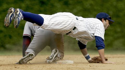 Todd Walker of the Chicago Cubs flips over a Washington Nationals player after throwing the ball on a double play during a game in Chicago on May 18, 2006.