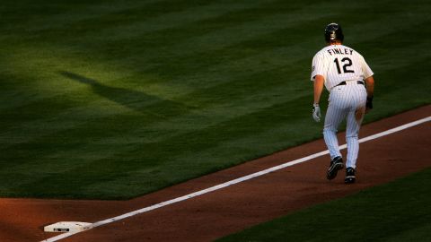 Steve Finley of the Colorado Rockies takes a lead off third base against the San Francisco Giants at Coors Field on May 10, 2007, in Denver.