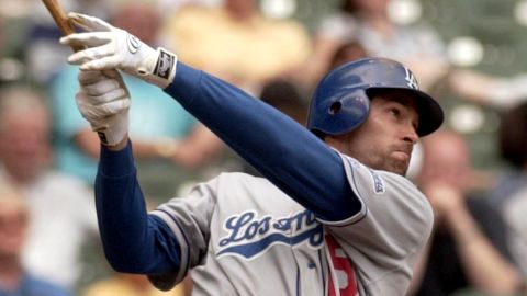 Los Angeles Dodgers outfielder Shawn Green hits his fourth home run of the day against the Milwaukee Brewers on May 23, 2002, in Milwaukee, Wisconsin.