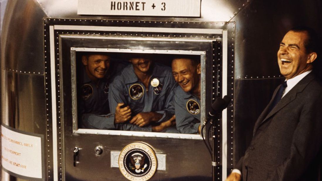 Apollo 11 astronauts Neil Armstrong, Michael Collins and Buzz Aldrin laugh with President Nixon aboard the USS Hornet on July 24, 1969. The president was on hand to greet the astronauts after their splashdown in the Pacific.