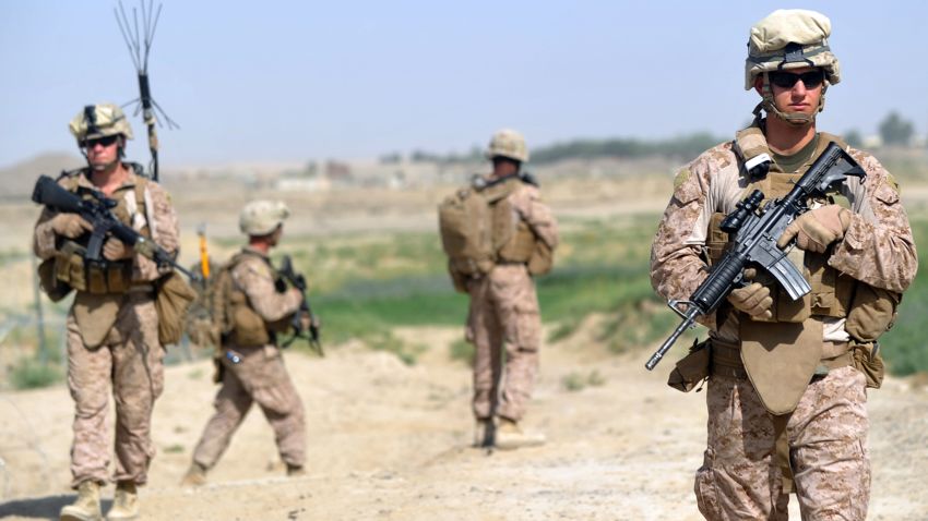 US Marines from Kilo Company of the 3rd Battalion 8th Marines Regiment start their patrol from FOB (Forward Operating Base) Delhi in Garmser, Helmand Province on June 27, 2012. The 130,000 NATO troops are due to leave Afghanistan by the end of 2014 and there are fears that their exit will lead to a reduction in rights and freedoms in the war-torn country. AFP PHOTO / ADEK BERRY        (Photo credit should read ADEK BERRY/AFP/GettyImages)