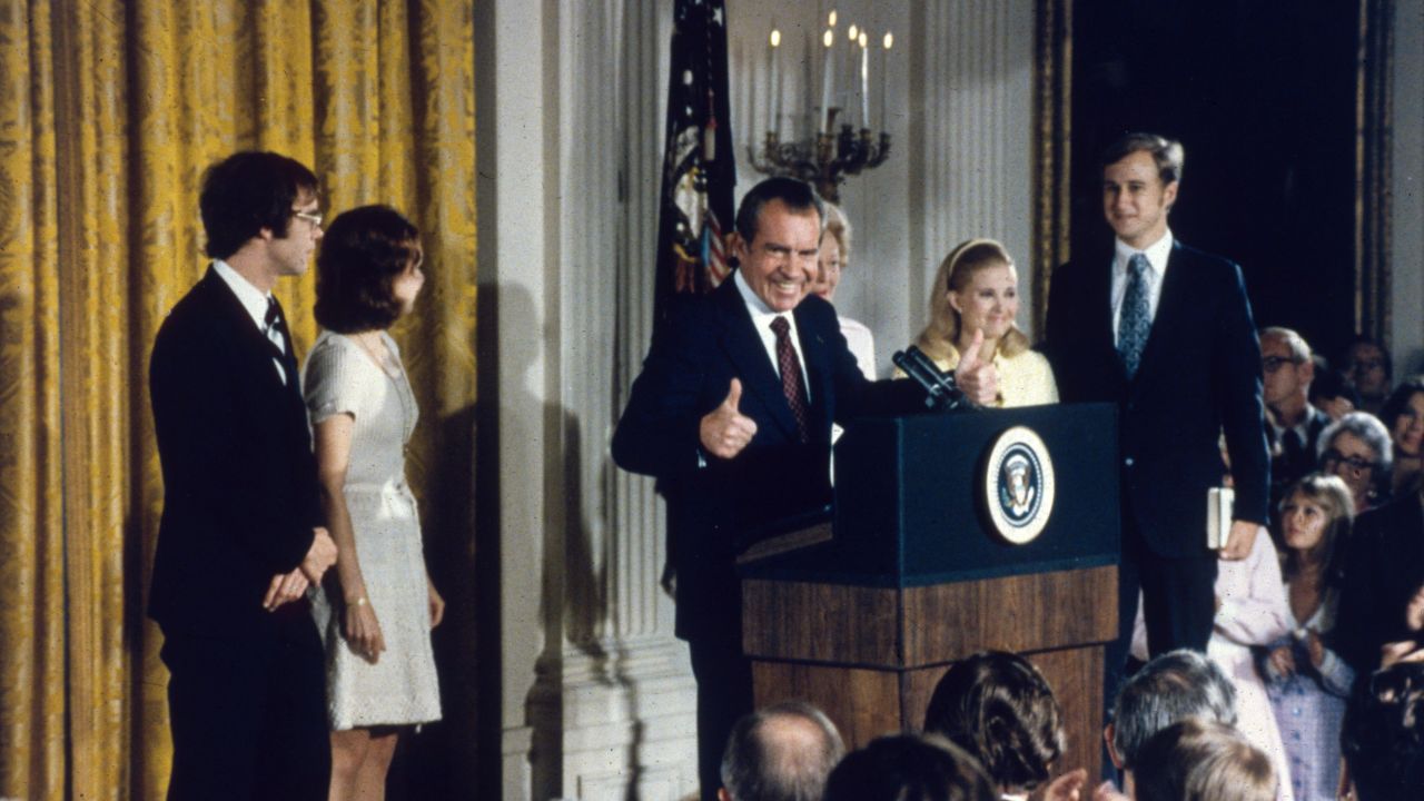 Surrounded by family members, Nixon delivers his resignation speech on August 9, 1974. He stepped down after the Watergate scandal, which stemmed from a break-in at the Democratic National Committee offices during the 1972 campaign.