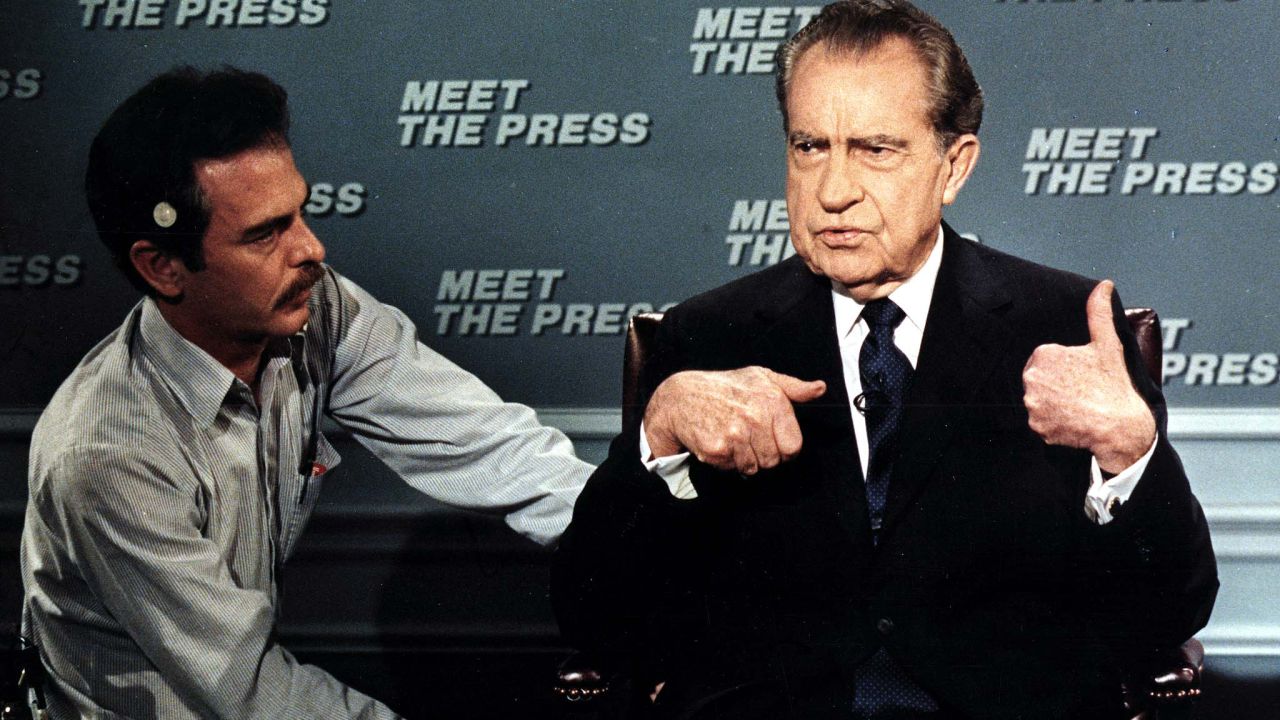 Former President Nixon is wired for a microphone on April 9, 1988, before the taping of the NBC television show "Meet the Press." It was his first appearance on the show since 1968.