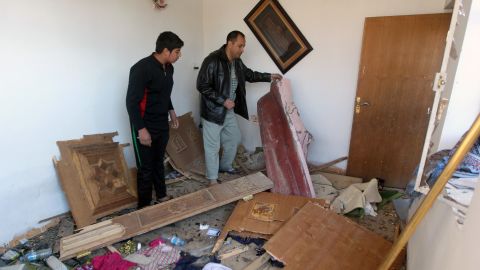 Iraqi inspect their house damaged by the explosion that killed at least three people on January 10, 2013, in the Hurriyah.