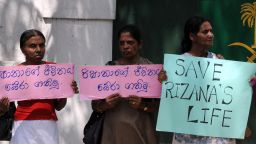 (File photo) Sri Lankan women hold a placard in protest, outside the Saudi Arabia embassy in Colombo on November 9, 2010, to spare the life of a Sri Lankan housemaid convicted of killing an infant. 