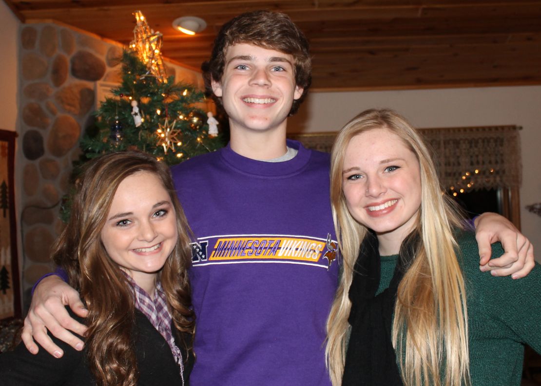 Max Schwolert poses with his sisters, Zoey, left, and Jazzy.