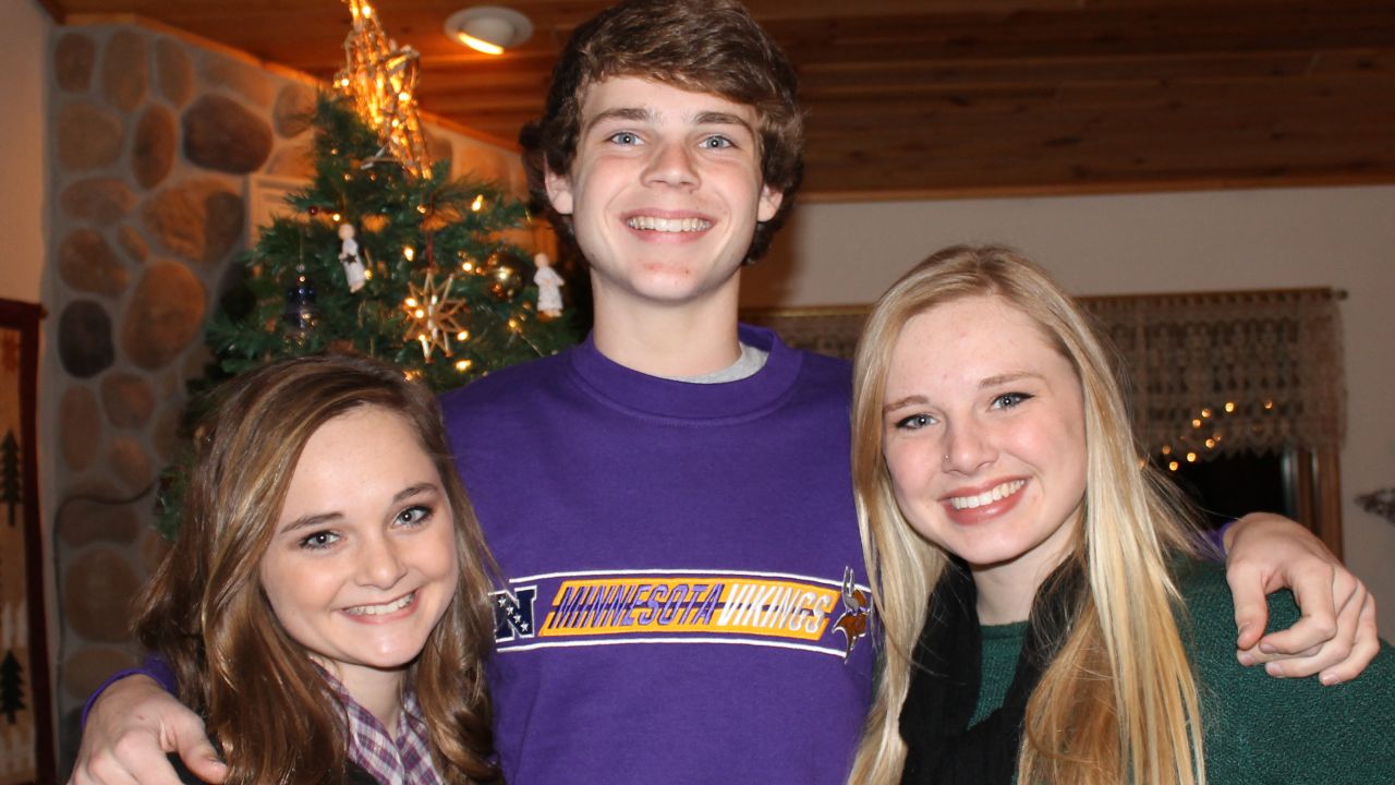 Max Schwolert poses with his sisters, Zoey, left, and Jazzy.