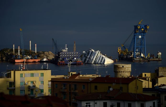 On January 13, 2012, the cruise ship Costa Concordia crashed into a bed of rocks near the port on the Italian island of Giglio, taking 32 lives. Although the ship owner announced that efforts to move the cruise liner would begin in May, the ship carcass still lies halfway submerged a year later. 