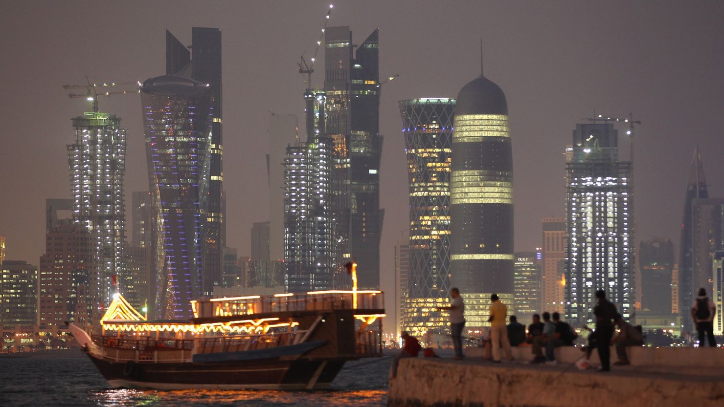 (File photo) Qatar sparkles: A boat arrives at a jetty in front of the Doha skyline.