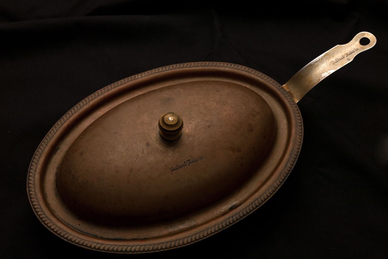 Another donation from Joe Molick, this oval shaped frying pan made of copper and stainless steel is engraved with unmistakeable Waldorf Astoria insignia on the handle, lid and underneath the pan.