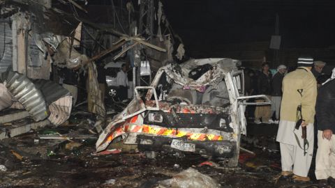 Pakistani security officials examine the site of a deadly bomb attack in Quetta on Thursday.