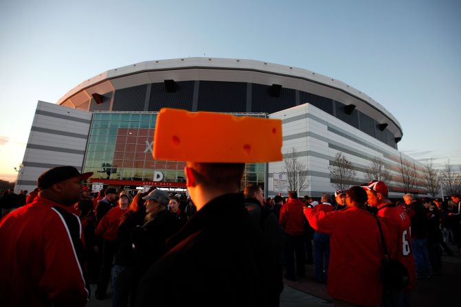 A Green Bay Packers fan (known as a cheesehead) waits to enter the Georgia Dome in Atlanta before the 2011 Green Bay Packers vs. Atlanta Falcons divisional playoff.