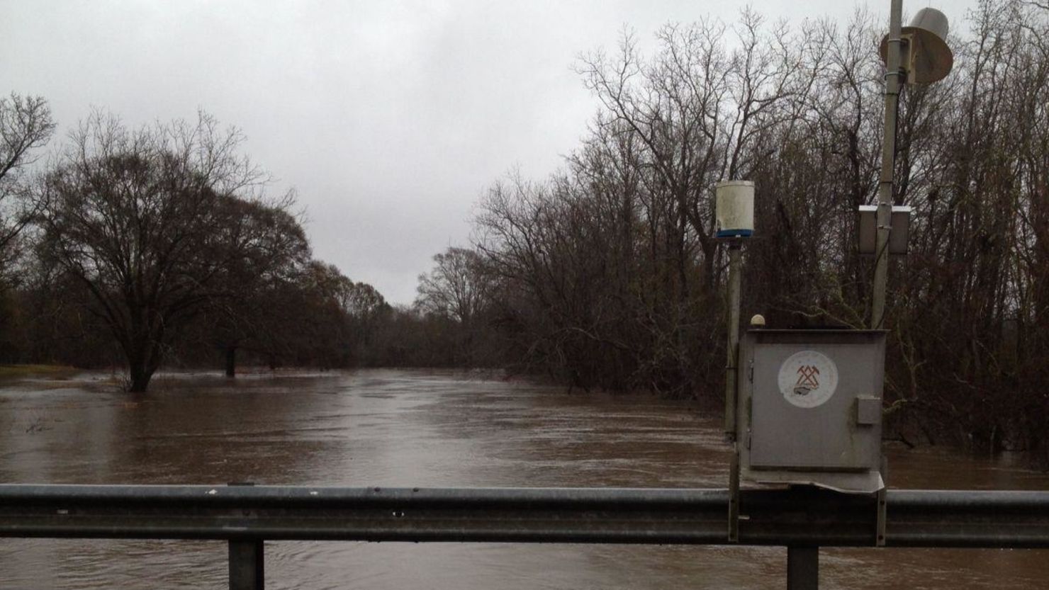 A flood gauge keeps track of rising waters Thursday in Louisiana.