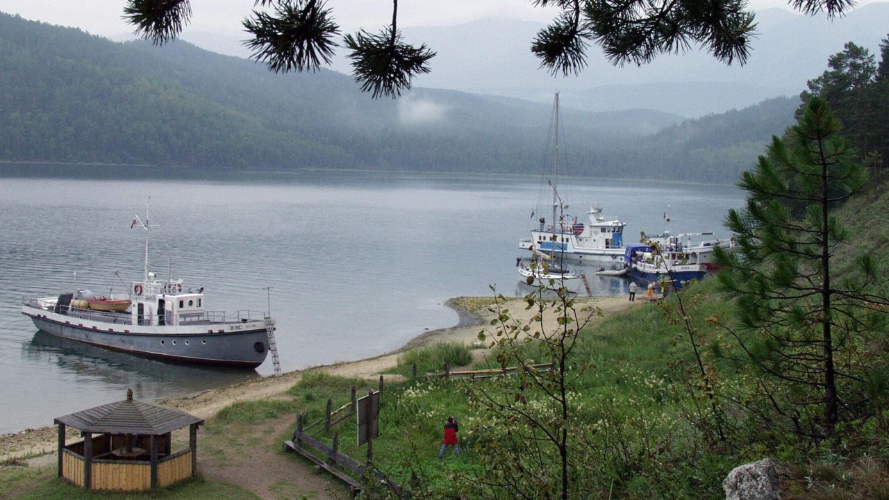 Tourists boats moored on the shore of Lake Baikal, Russia.