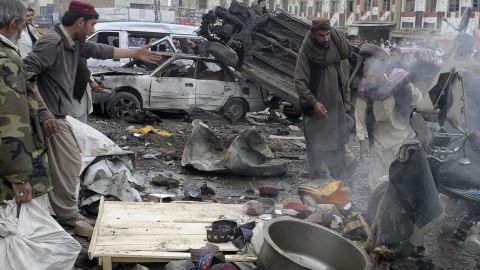 Debris and mangled vehicles are seen at the site of a bomb explosion in Quetta on January 10, 2013.