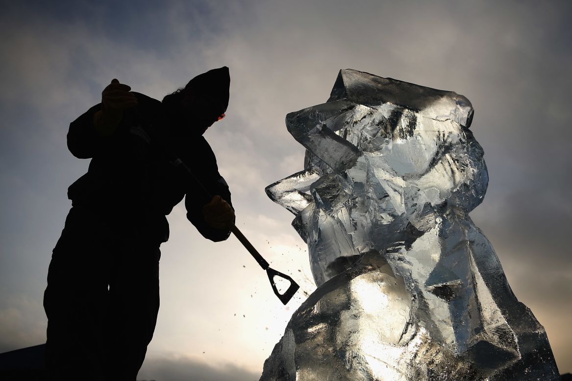  A contestant works on an ice sculpture at The London Ice Sculpting Festival at Canary Wharf on Friday, January 11 in London. Ice and snow festivals are taking place all around the world, showcasing creative ways to enjoy the cold weather.
