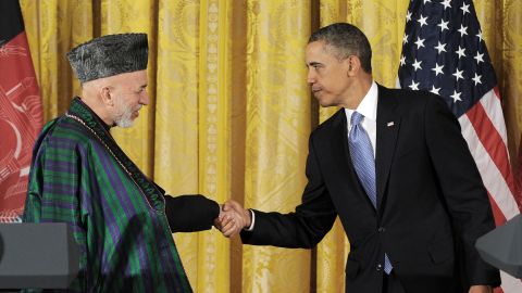U.S. President Barack Obama and Afghan President Hamid Karzai shake hands after Friday's joint news conference.