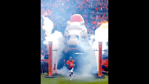 Denver quarterback Peyton Manning takes the field during player introductions on Saturday.