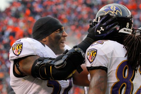 Ravens linebacker Ray Lewis congratulates Torrey Smith after his 32-yard touchdown catch in the second quarter.